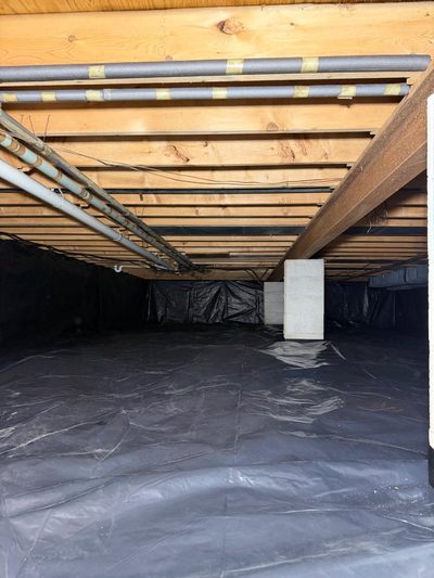 Crawl space cleaned, new vapor barrier — after